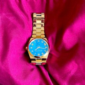 Michael Kora women’s watch with original extra links and original tags.